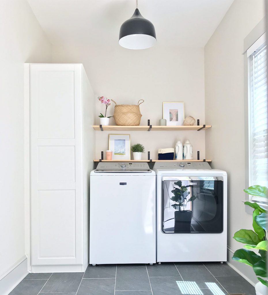 Modern farmhouse laundry room with two floating shelves using metal brackets and wood