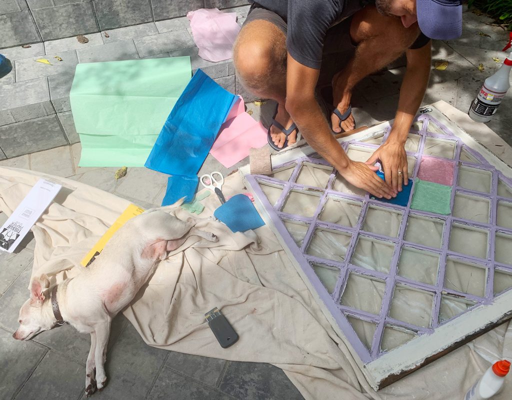 John Testing Tissue Paper Colors On Diamond Glass Window