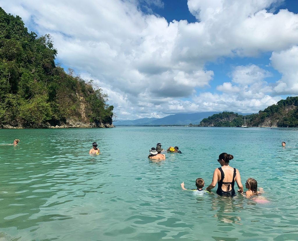 Costa Rica beach with kids and Sherry in water